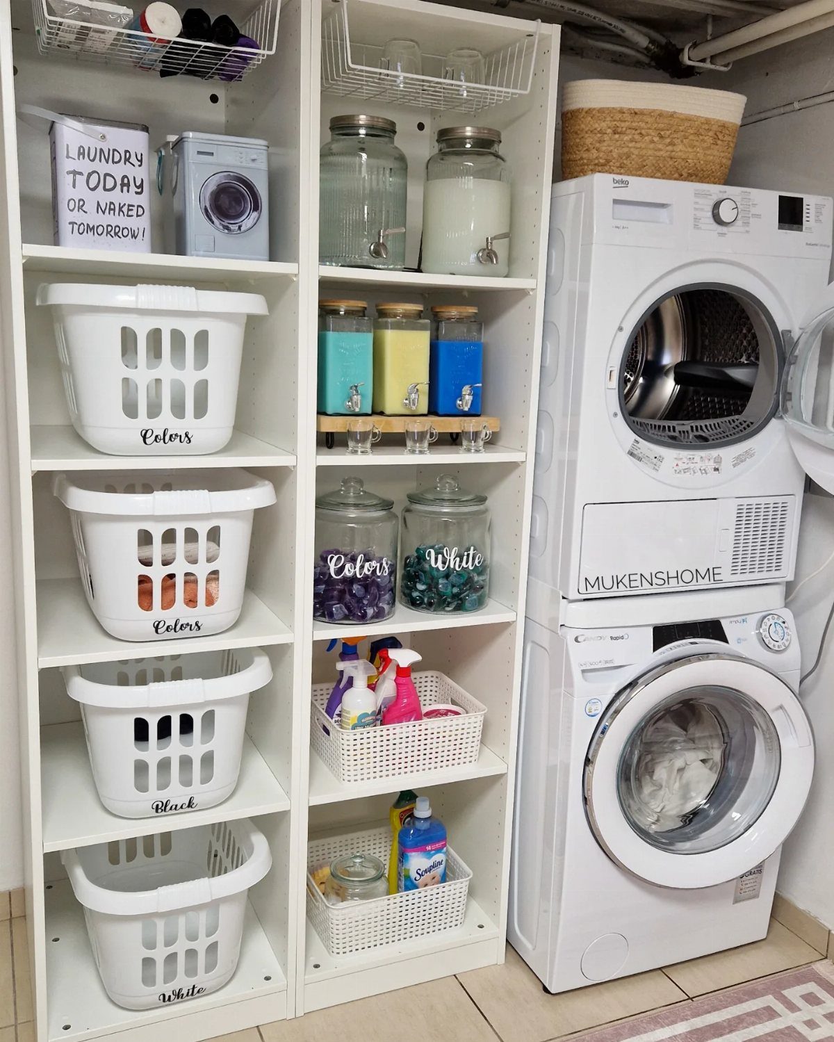 White laundry room setup with stacked washer dryer and organized shelving units.