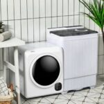 Two compact white laundry machines on a patterned tile floor against white tiles.