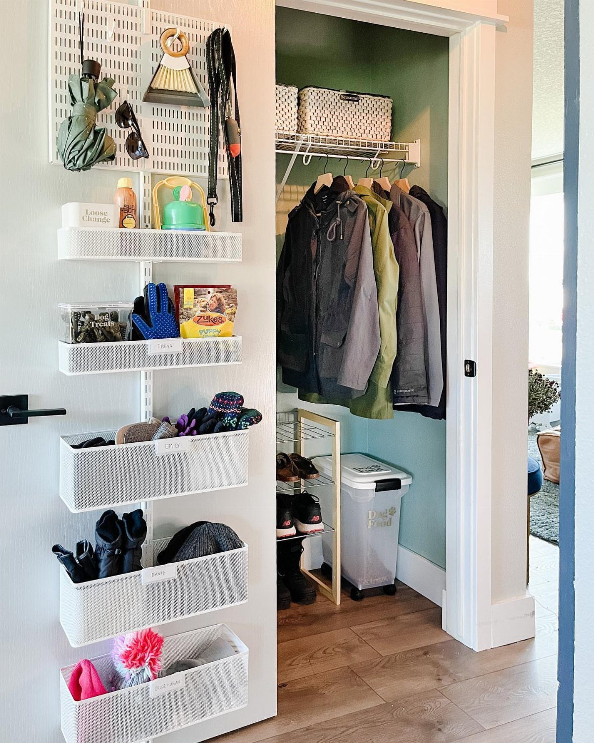 Winter gear and jackets organized in a small walk-in closet with over-the-door storage.